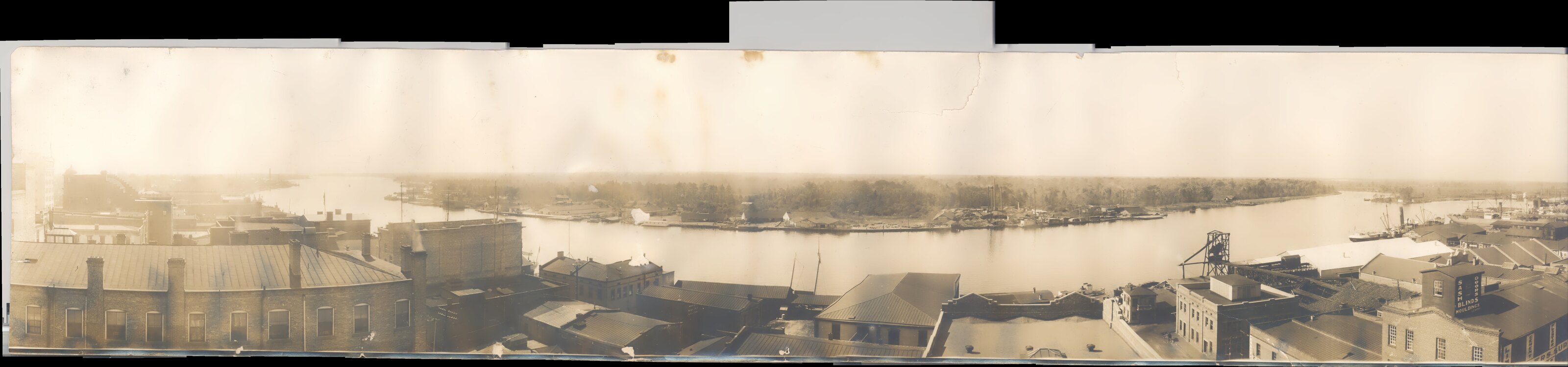 Historic panoramic view across the Cape Fear River toward the industrial shoreline of Eagles Island