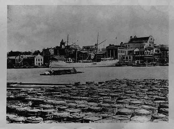 Historic view from the Eagles Island naval-stores wharves across the Cape Fear River toward Market Street