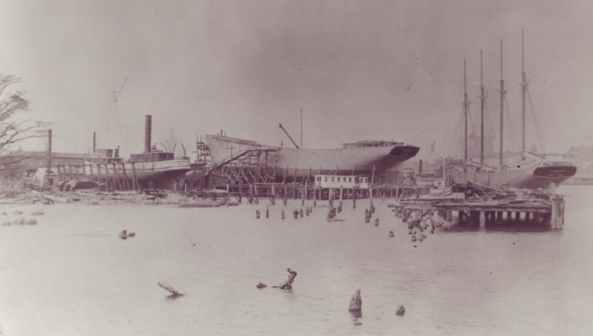 Historic shipyard view showing schooners under construction at Wilmington Marine Railway